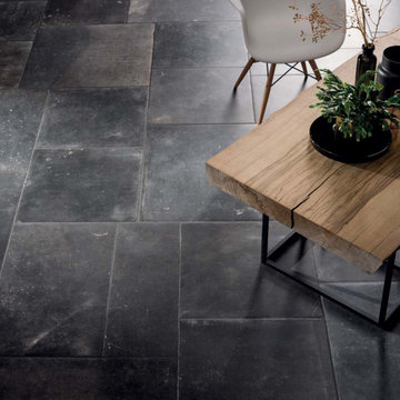 Modern black living room with black stone look porcelain tile