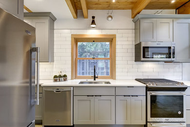 Kitchen - industrial kitchen idea in Other