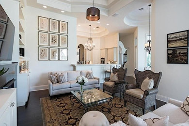 Inspiration for a transitional dark wood floor and brown floor family room remodel in Miami