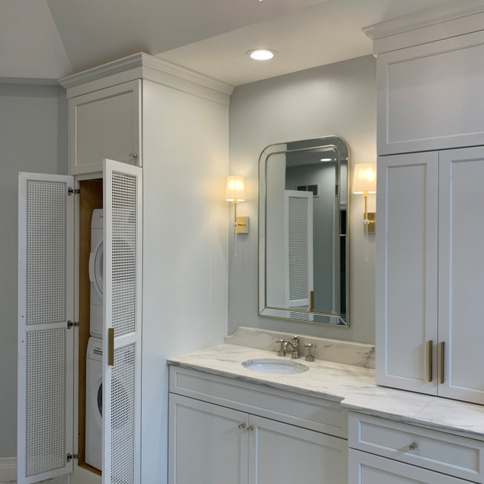 Example of a mid-sized transitional master porcelain tile, multicolored floor, double-sink, vaulted ceiling and wallpaper bathroom design in Indianapolis with shaker cabinets, white cabinets, a one-pi