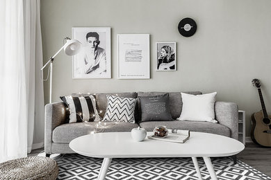 Trendy porcelain tile living room photo in Other with gray walls