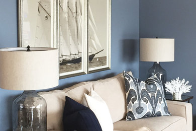 Example of a mid-sized beach style formal and enclosed living room design in New York with blue walls, no fireplace and no tv