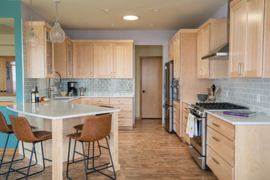 Inspiration for a mid-sized transitional u-shaped medium tone wood floor and brown floor eat-in kitchen remodel in Other with an undermount sink, shaker cabinets, light wood cabinets, quartz countertops, green backsplash, ceramic backsplash, stainless steel appliances, a peninsula and white countertops