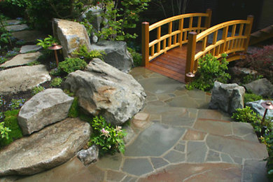 Photo of a large traditional landscaping in Other.