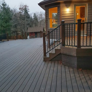 Example of a large classic backyard deck design in New York with no cover