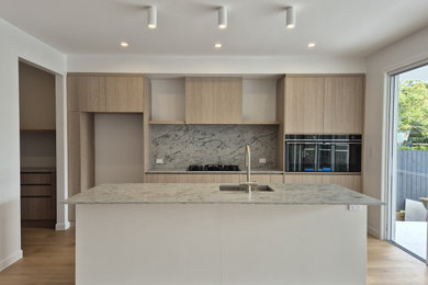 Inspiration for a contemporary kitchen in Brisbane with with island.