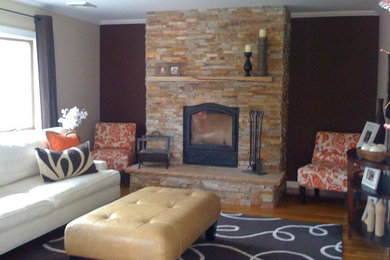 Large elegant family room photo in New York with a standard fireplace and a stone fireplace