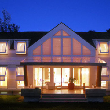 Nightime view of porch with tree trunk columns