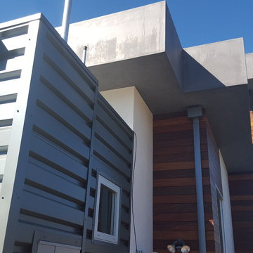 24 Gauge Steel, Collector Box and Downspout on Matching Wall Panels.