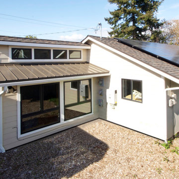 Our work added both a passive solar addition and an active solar array to this e