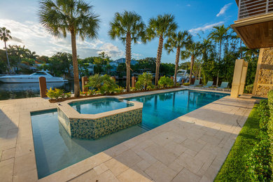 Island style pool photo in Tampa