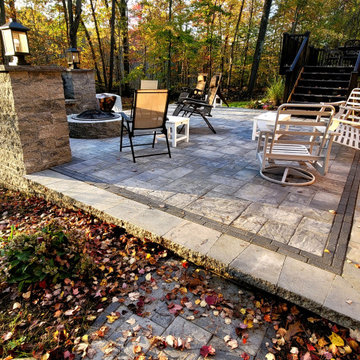 Landscaping and Patio in Niskayuna with firepit and deck. Includes sitting walls