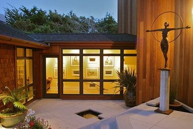 This is an example of a large modern two-storey brown exterior in San Francisco with wood siding.