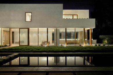 Large minimalist white two-story exterior home photo in Los Angeles
