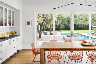 Example of a country dining room design in Austin