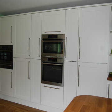 Ivory Shaker style kitchen with integrated appliances.