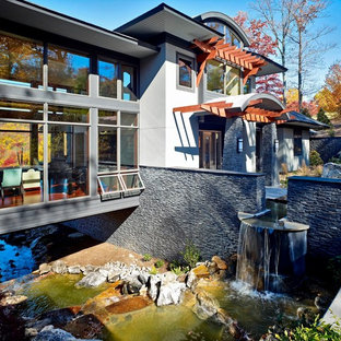 他の地域のコンテンポラリースタイルのおしゃれな家の外観 (石材サイディング) の写真