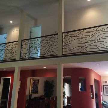 Ornamental railing with wood handrail