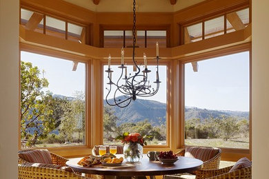 Example of a mid-sized transitional enclosed dining room design in San Francisco with blue walls and a stone fireplace