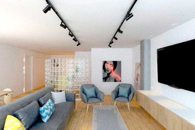 Foto de sala de estar tipo loft actual de tamaño medio con televisor colgado en la pared