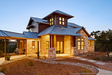 Inspiration for a huge contemporary beige two-story stone exterior home remodel in Austin