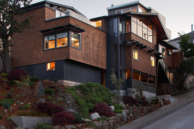 This is an example of a large contemporary two-storey brown exterior in San Francisco with wood siding and a gable roof.