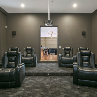 Large trendy enclosed carpeted home theater photo in Geelong with gray walls and a projector screen