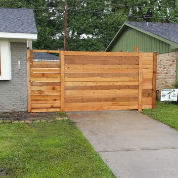 Custom Horizontal cedar fence with automatic swing gate