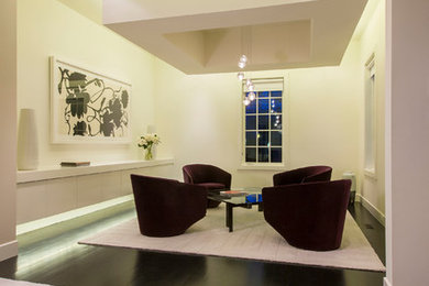 Inspiration for a mid-sized modern loft-style dark wood floor living room remodel in DC Metro with beige walls