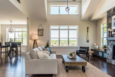 Living room - transitional dark wood floor living room idea in Other with white walls, a standard fireplace and a stone fireplace