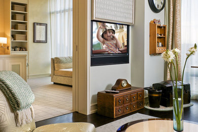 Example of a mid-sized classic enclosed dark wood floor living room design in Detroit with beige walls and a concealed tv