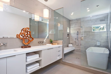 Example of a trendy master gray tile gray floor bathroom design in Los Angeles with flat-panel cabinets, gray cabinets, an undermount sink and white countertops