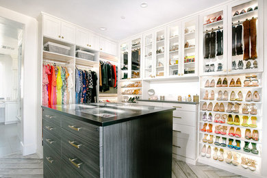 Huge transitional gender-neutral medium tone wood floor and gray floor walk-in closet photo in Sacramento with flat-panel cabinets and white cabinets