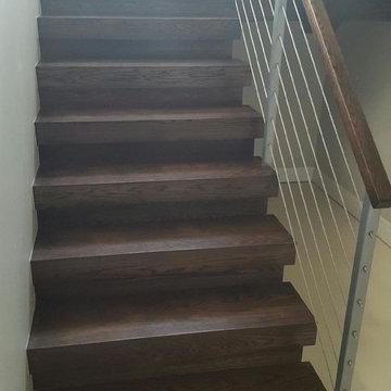 Open riser stairs with stainless steel cable wire railing