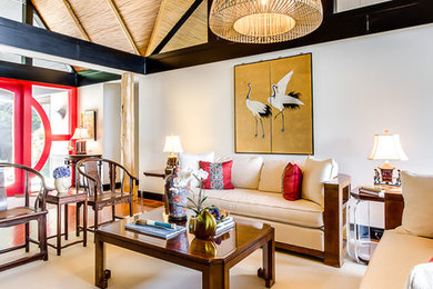Living room - mid-sized formal and enclosed carpeted and beige floor living room idea in Other with white walls