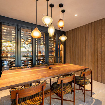 Modern Bronze Steel Wine Wall and Liquor Display in Luxury Custom Home Basement