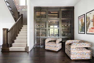 Huge transitional wine cellar photo in Portland with display racks