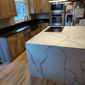 Double Waterfall Quartz island with Black Granite Perimeter
