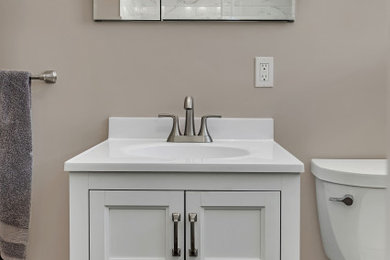 Mid-sized trendy master white tile and subway tile single-sink sliding shower door photo in San Francisco with recessed-panel cabinets and white cabinets