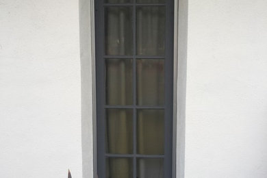Inspiration for a beige stucco exterior home remodel in Los Angeles