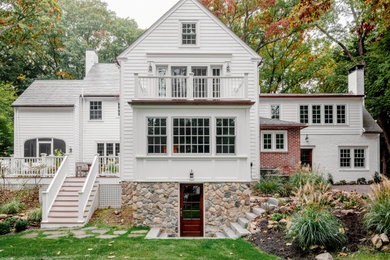 Large traditional white two-story wood and clapboard exterior home idea in Boston with a shingle roof and a gray roof