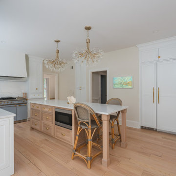 Château Charm: French-Inspired Kitchen Renovation with Plaster Hood Blue Stove a