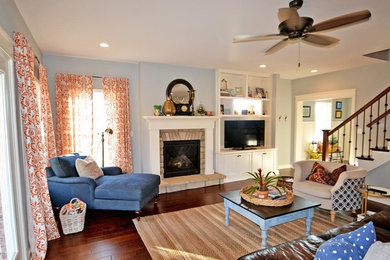 Mid-sized transitional formal and enclosed dark wood floor and brown floor living room photo in Louisville with blue walls, a standard fireplace, a stone fireplace and a tv stand