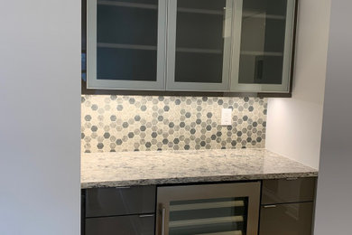 Inspiration for a modern home bar remodel in New York