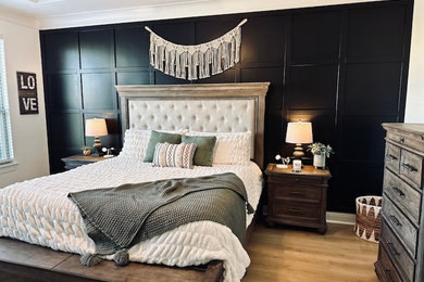 Bedroom - craftsman master wood wall bedroom idea in Dallas with black walls