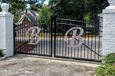 Design ideas for a mid-sized traditional full sun front yard driveway in Other.