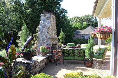 Mid-sized elegant backyard concrete patio photo in Jackson with a fire pit and a roof extension