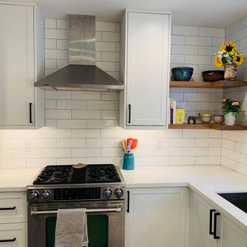 ikea white cabinets with subway tile backsplash and floating shelves