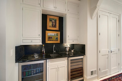 Example of a classic home bar design in Other