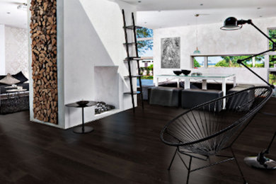 Living room - large modern formal and enclosed dark wood floor and brown floor living room idea in Phoenix with gray walls, a two-sided fireplace, a plaster fireplace and no tv
